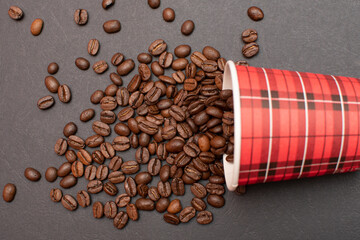 Paper cup and roasted coffee beans	
