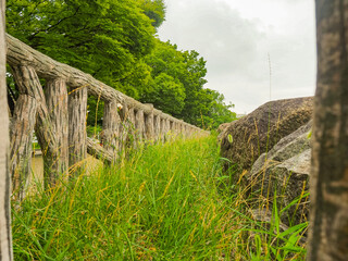 old stone bridge with grass and rocks