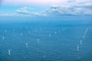 Aerial view of offshore wind farm with wind turbines on the North Sea