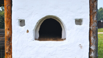 Traditional Russian oven, outdoors under a canopy. The picture was taken in Russia, in the city of Orenburg