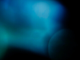 Colorful light leak on dark background. Cinematic visual lens effect for design and creative ideas. Abstract wall paper.