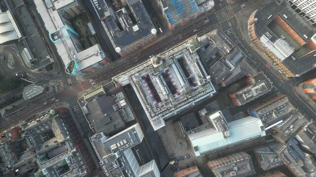 Aerial drone shot across Manchester shot from the west looking east at Deansgate Square, Manchester, UK