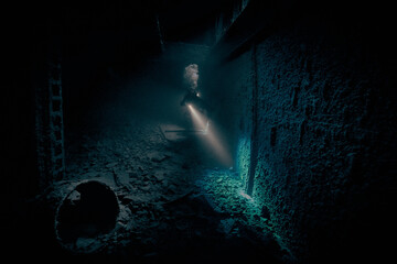 Mysterious underwater view inside the ship wreck of SS Thistlegorm - British cargo steamship sunk by German bomber in the Red Sea, near Sharm El Sheikh, Egypt. Underwater photography and travel