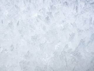 close-up of ice crystals pattern. frosty pattern. nature pattern. frozen water texture. winter frost. ice texture. white minimalistic background