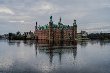 Naklejka premium The whole Frederiksborg Castle with reflections