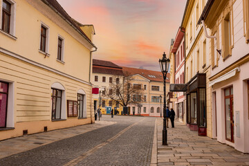 Narrow picturesque street with baroque and renaissance historical buildings. Cityscape of medieval town Pisek, Czechia.