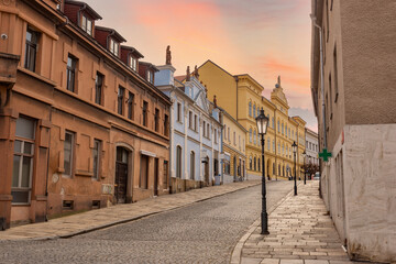 Narrow picturesque street with baroque and renaissance historical buildings. Cityscape of medieval...