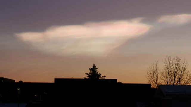 Nacreous polar stratospheric clouds over buildings in Reykjavik Iceland
