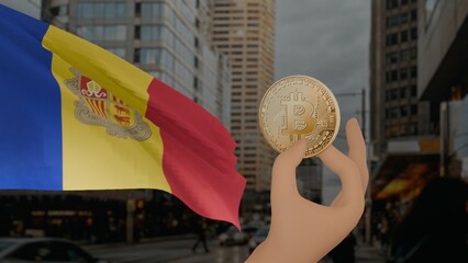 Golden bitcoin held by a hand with a waving Andorra flag in the background against a modern urban...