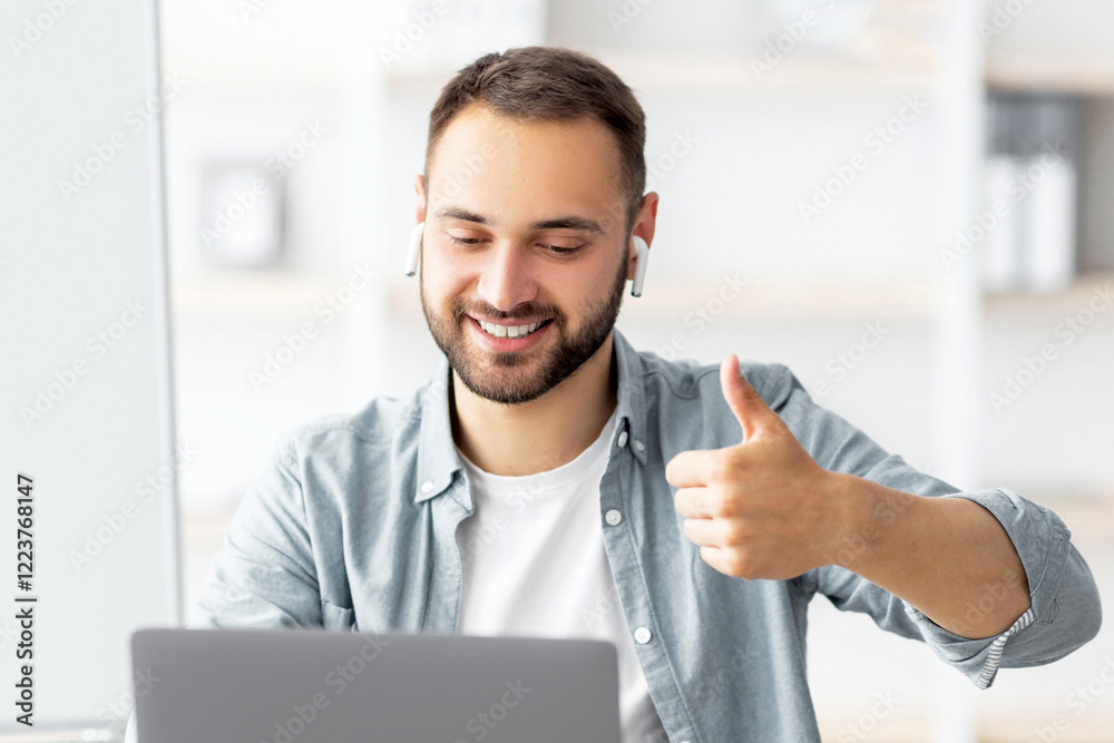 Poster happy male teacher giving english lesson on web using laptop, gesturing thumb up, recommending forei
