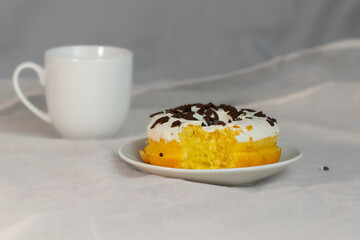 Bitten cake with white icing.Colorful donuts have been bitten.