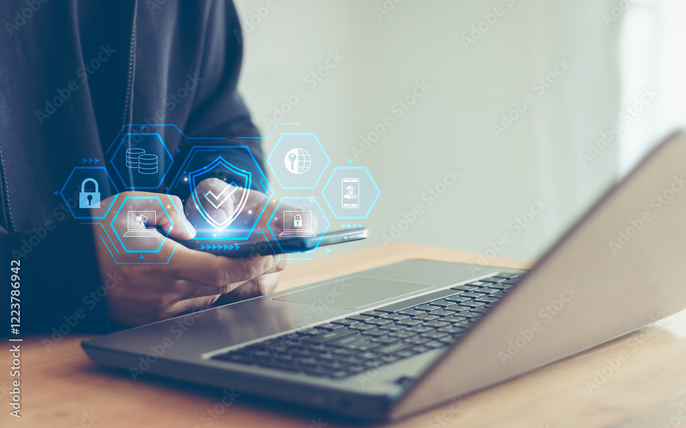 Leinwandbilder Cyber security and data protection concept. Man utilizes a mobile phone with a privacy security and data encryption system for secure internet access. cybersecurity software technology for business.