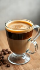 Layered Coffee in Clear Glass Mug on Wooden Table