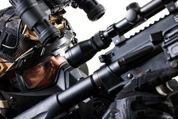 Close-Up of Tactical Operator Aiming Rifle With Precision Optics and Combat Gear