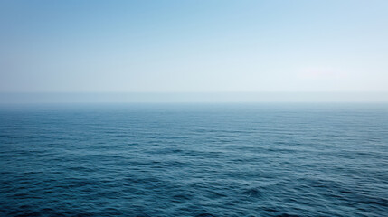 serene view of calm ocean under clear blue sky, evoking tranquility and peace. gentle waves create soothing atmosphere, perfect for relaxation