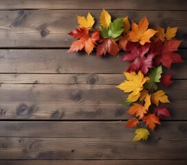 Obraz premium Stunning autumn branch with multicolored leaves on a rustic wooden background, autumn color, rustic wood