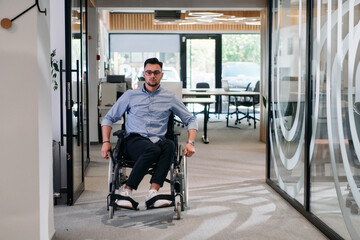 In a large modern corporation, a determined businessman in a wheelchair navigates through a...