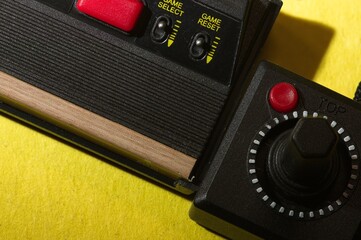 Close up of vintage game console with joystick