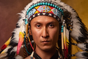 A man wearing a Native American headdress