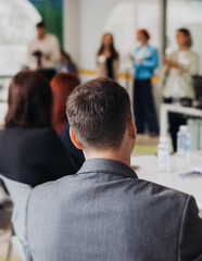 Audience team on master class seminar, working together during contest competition in the auditorium class, corporate workshop, company coworkers and colleagues listen to lecturer on a conference