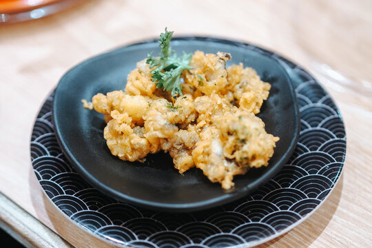 Ika geso karaage is a Japanese dish of deep-fried squid tentacles that are crispy and flavorful