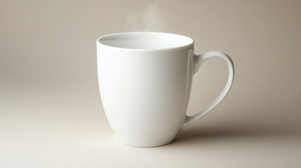 Fototapeta premium A steaming hot beverage in a simple white mug. Perfect for a cozy morning.