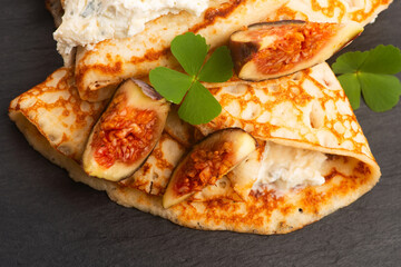 Crepes or thin pancakes with gorgonzola cheese, honey and figs fruits