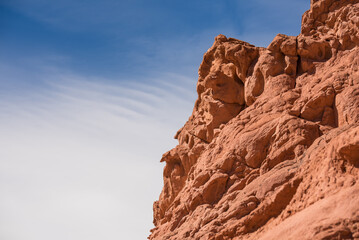 Fototapeta premium Rocky desert formations colorful red mountain with a blue sky 