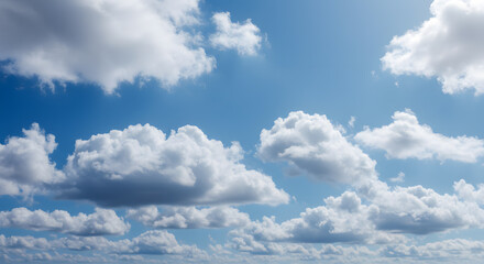 Fototapeta premium A high-resolution texture of soft, fluffy clouds in a gradient blue sky, ideal for overlays