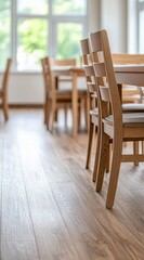 Bright and Airy Restaurant Interior with Wooden Chairs and Tables