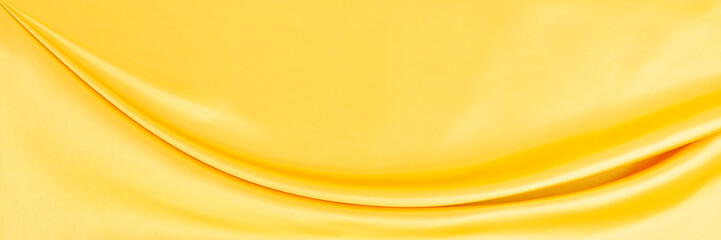 yellow gold satin texture that is white silver fabric luxurious shiny that is abstract silk cloth...