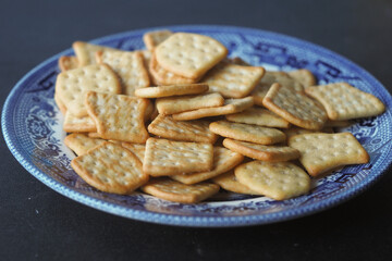 Savory crackers arranged on a decorative blue plate