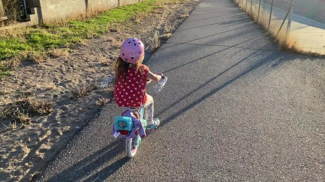 Little Girl Riding Bicycle without Training Wheels