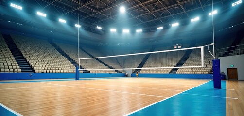 Indoor volleyball arena with wooden floor, blue sidelines. Spectator stands filled with empty seats. Volleyball net in center of court. Person in sports attire standing in court. Competitive sport