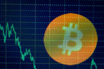 Bitcoin logo with falling stock graph background indicating market volatility