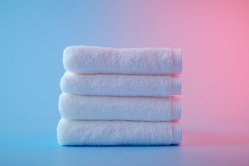 Three white towels on a blue background.