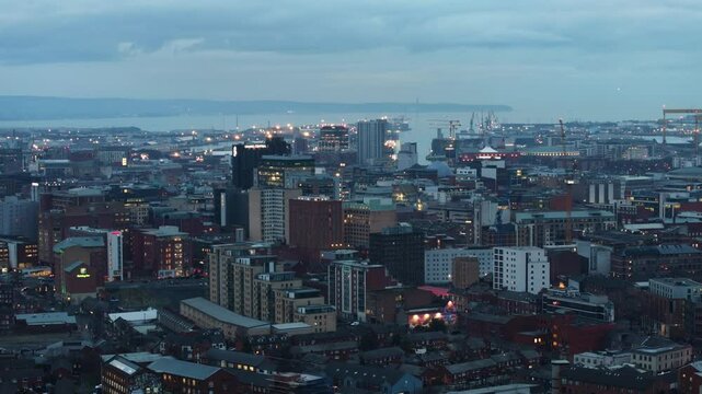 Aerial view of Residential homes and Business in Belfast City Skyline Cityscape Northern Ireland by night black background at night 27-01-25