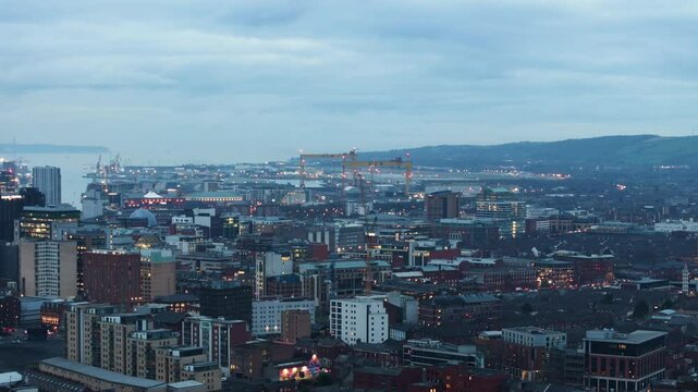 Aerial view of Residential homes and Business in Belfast City Skyline Cityscape Northern Ireland by night black background at night 27-01-25