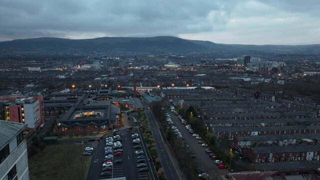 Aerial view of Residential homes and Business in Belfast City Skyline Cityscape Northern Ireland by night black background at night 27-01-25