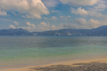 Patong Beach phuket Thailand beautiful turquoise blue waters on the white sand and long tail boats used for tourist 