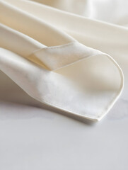 Close-Up of Smooth Elegant Beige Fabric with Soft Folds on a Neutral Background : Generative AI