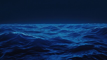 Fototapeta premium Gentle, pulsating waves of blue light spreading softly over a gradient navy background.