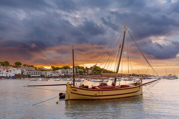 Early morning view of Cadaques Bay at sunrise, with boats anchored in the water, Spain