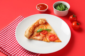 Plate with piece of tasty pizza Margarita and ingredients on red background