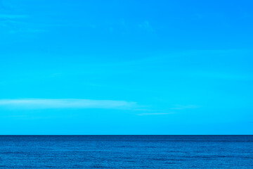 Nature of the beach and sea Summer with sunshine, sandy beaches, clear blue waters sparkling against the blue sky. On an island with good ecology and environment Background for summer vacation