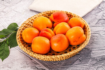 Raw ripe sweet apricots heap