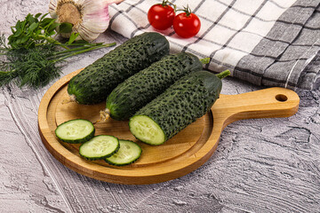 Raw green cucumbers with slices