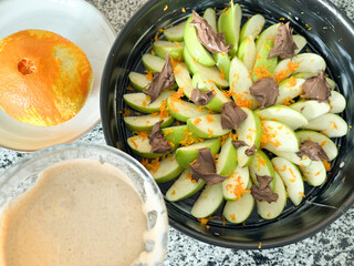 Refreshing green apple salad with chocolate and orange zest for a light snack