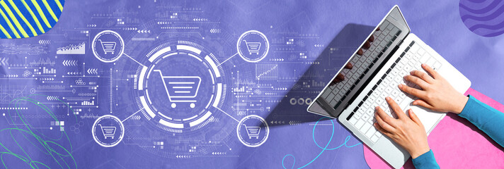 Online shopping theme with person using a laptop computer