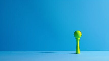 a bright green golf tee resting on a vivid blue background.